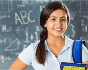 2 2 Smiling girl holding a notebook in a classroom